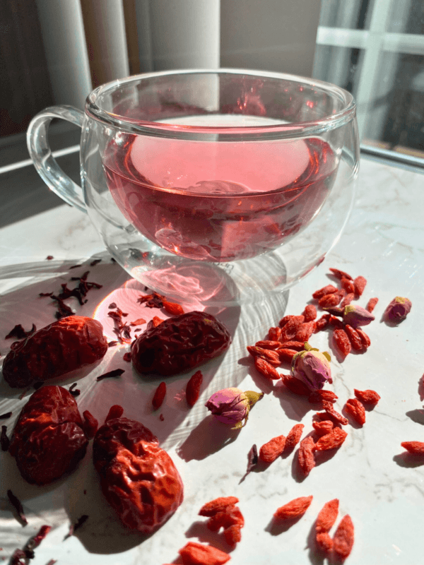 2024-11-Gobi-Goji-herbal-tea-Glowing-Rose-marble-table-angle.png